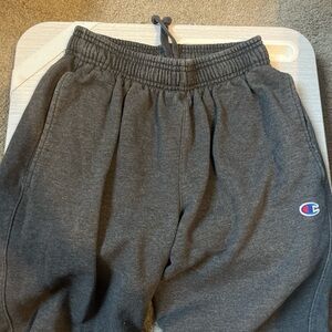 dark grey champion joggers w/ elastic waistband.